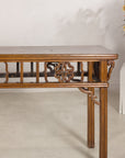 Right end view of the console table with openwork apron detail