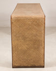 End view of the waterfall console showing woven rattan and dark wood trim
