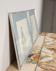 Side profile of a silvered frame holding a Japanese woodblock print