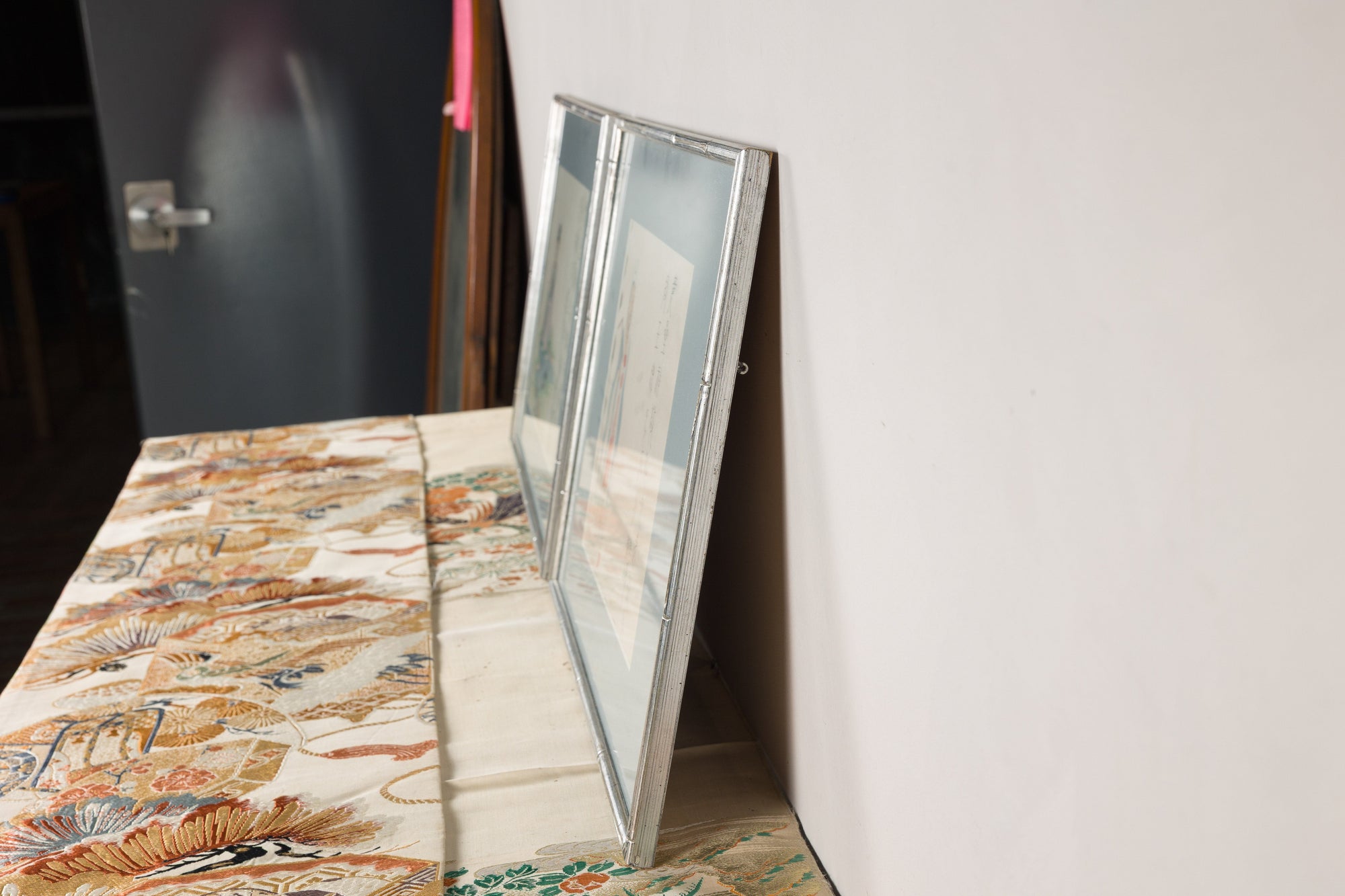 Alternate side profile of the paired silvered picture frames