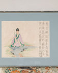 Framed Japanese print of a seated figure with calligraphy