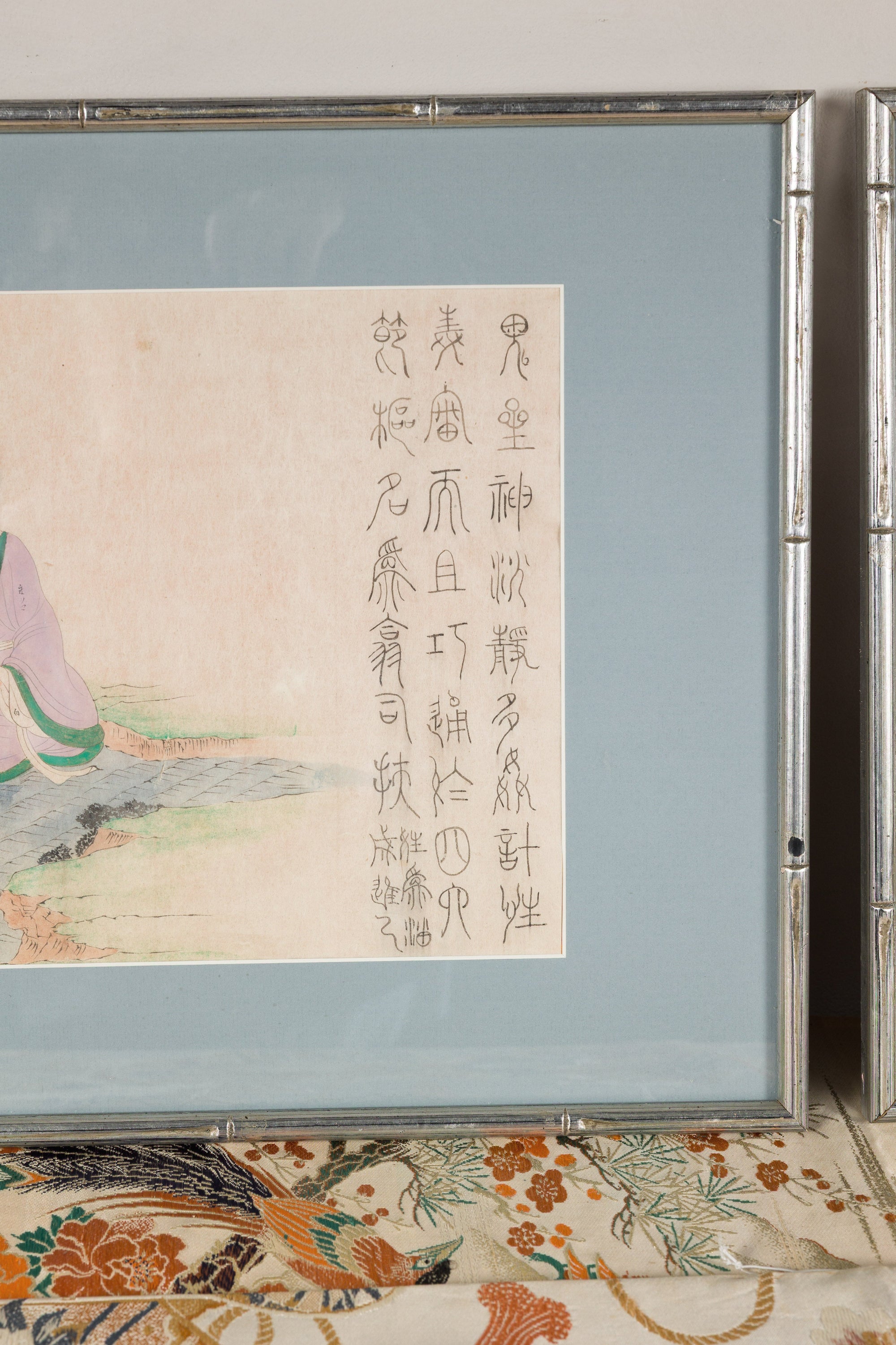 Detail of calligraphy beside the seated figure in a Japanese woodblock print