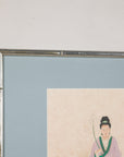 Close-up of the silvered frame and pale blue mat around a Japanese print
