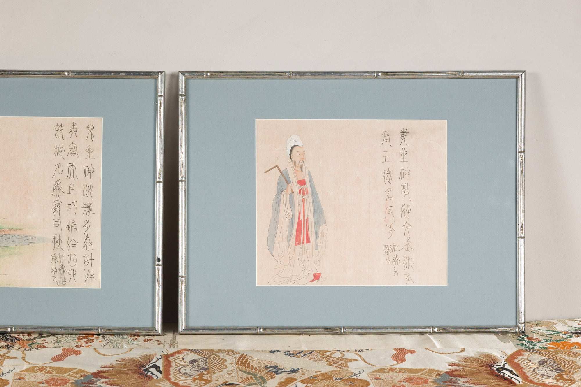 Close view emphasizing the standing figure print and calligraphy