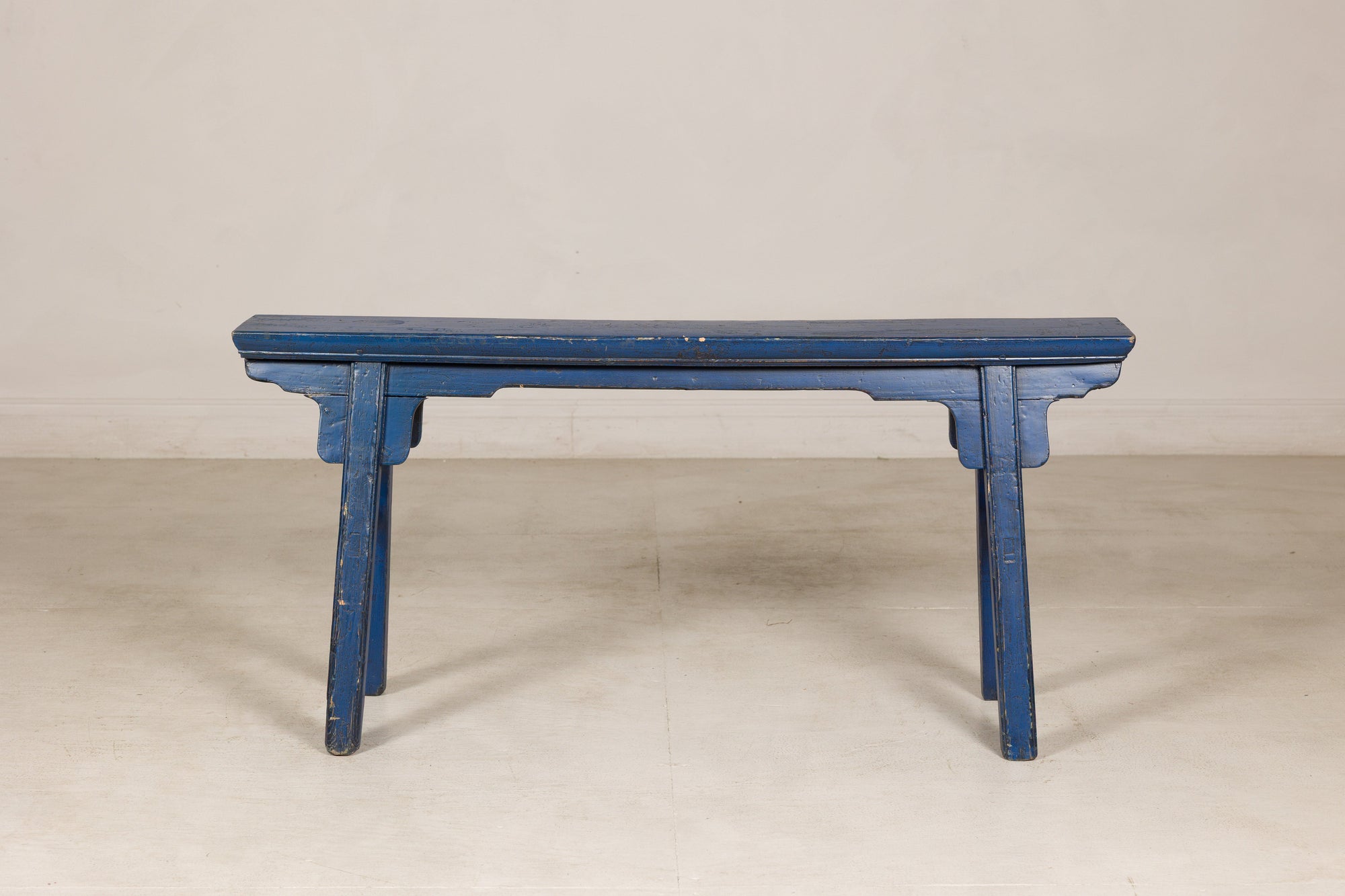 Blue painted wood narrow bench front view