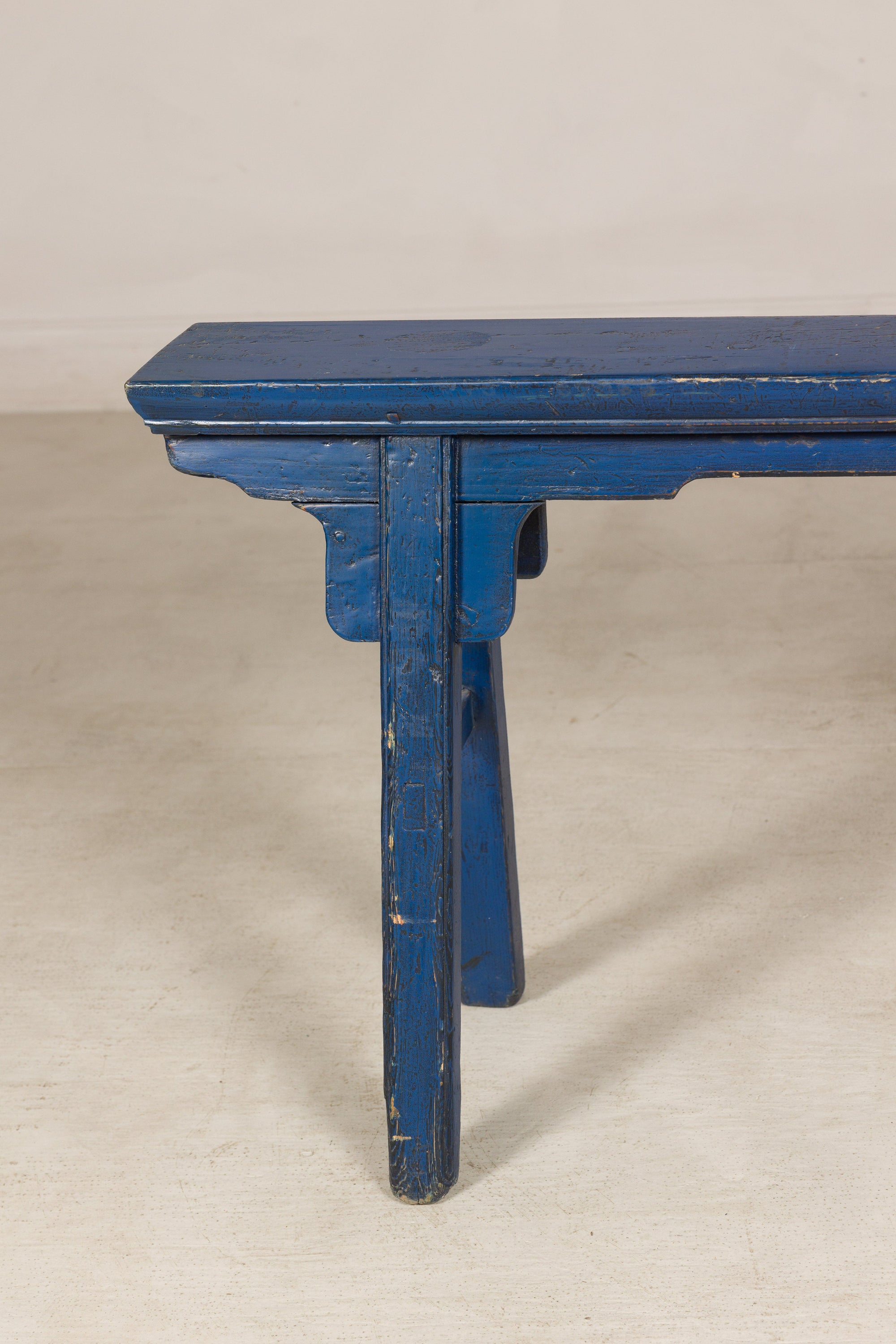 Blue painted wood narrow bench back view