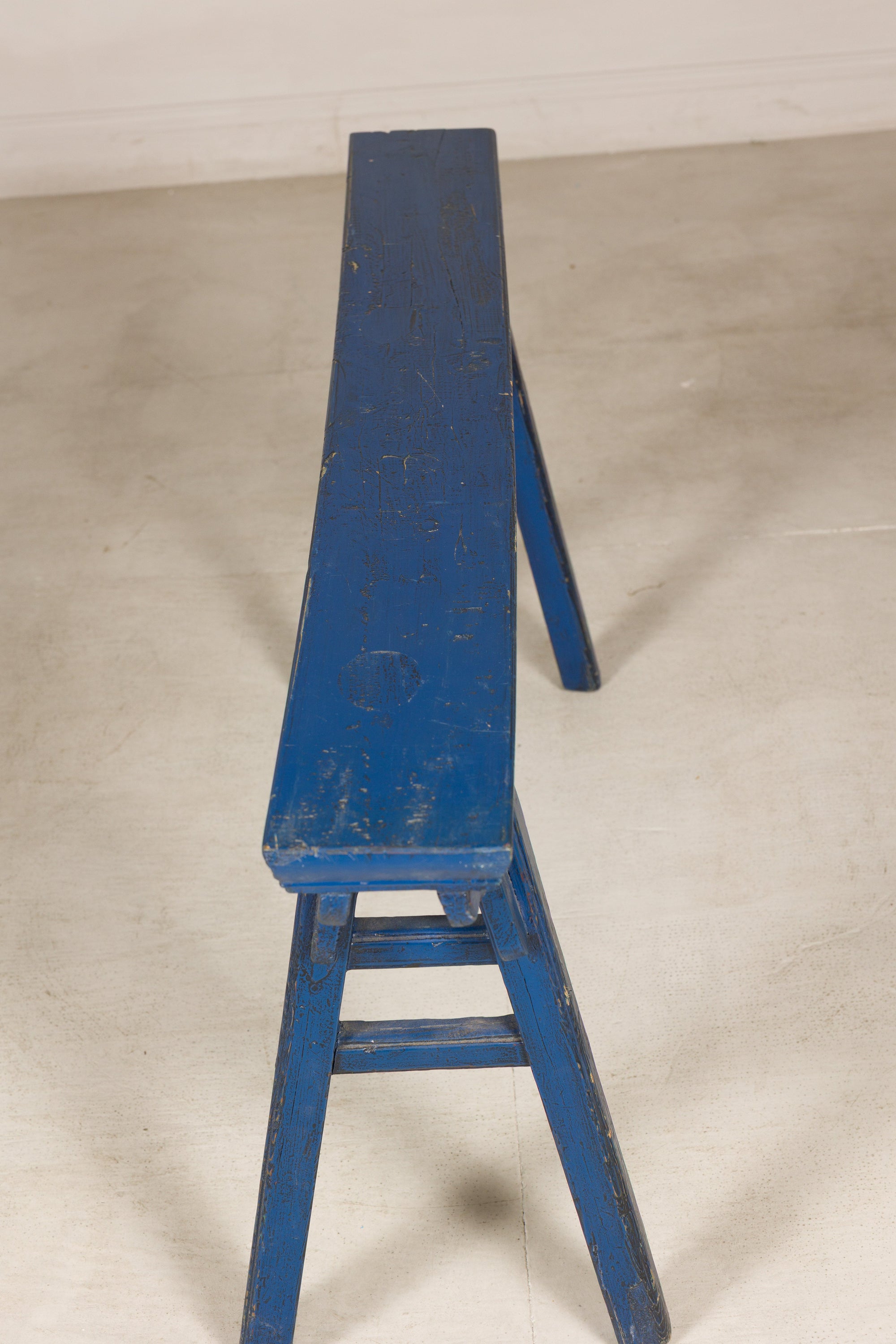 Blue painted wood narrow bench construction detail