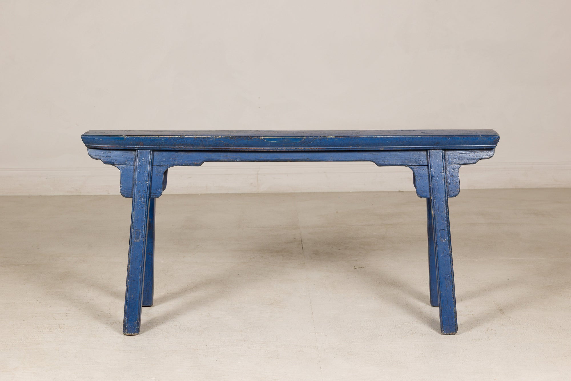 Blue painted wood narrow bench close-up detail