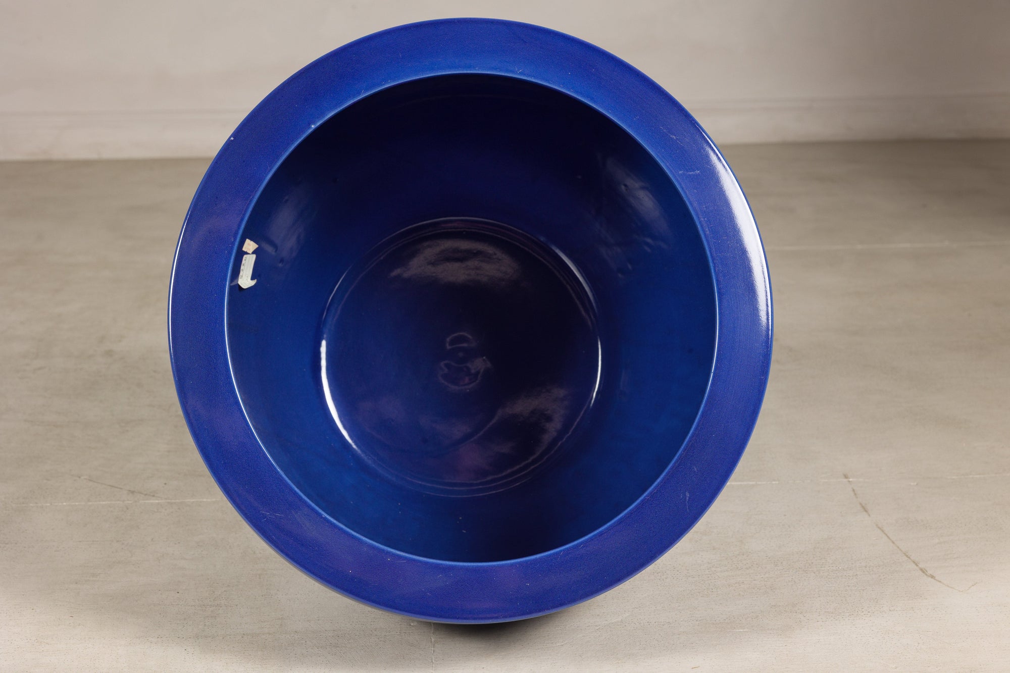 Top view into the deep blue glazed interior of the ceramic planter
