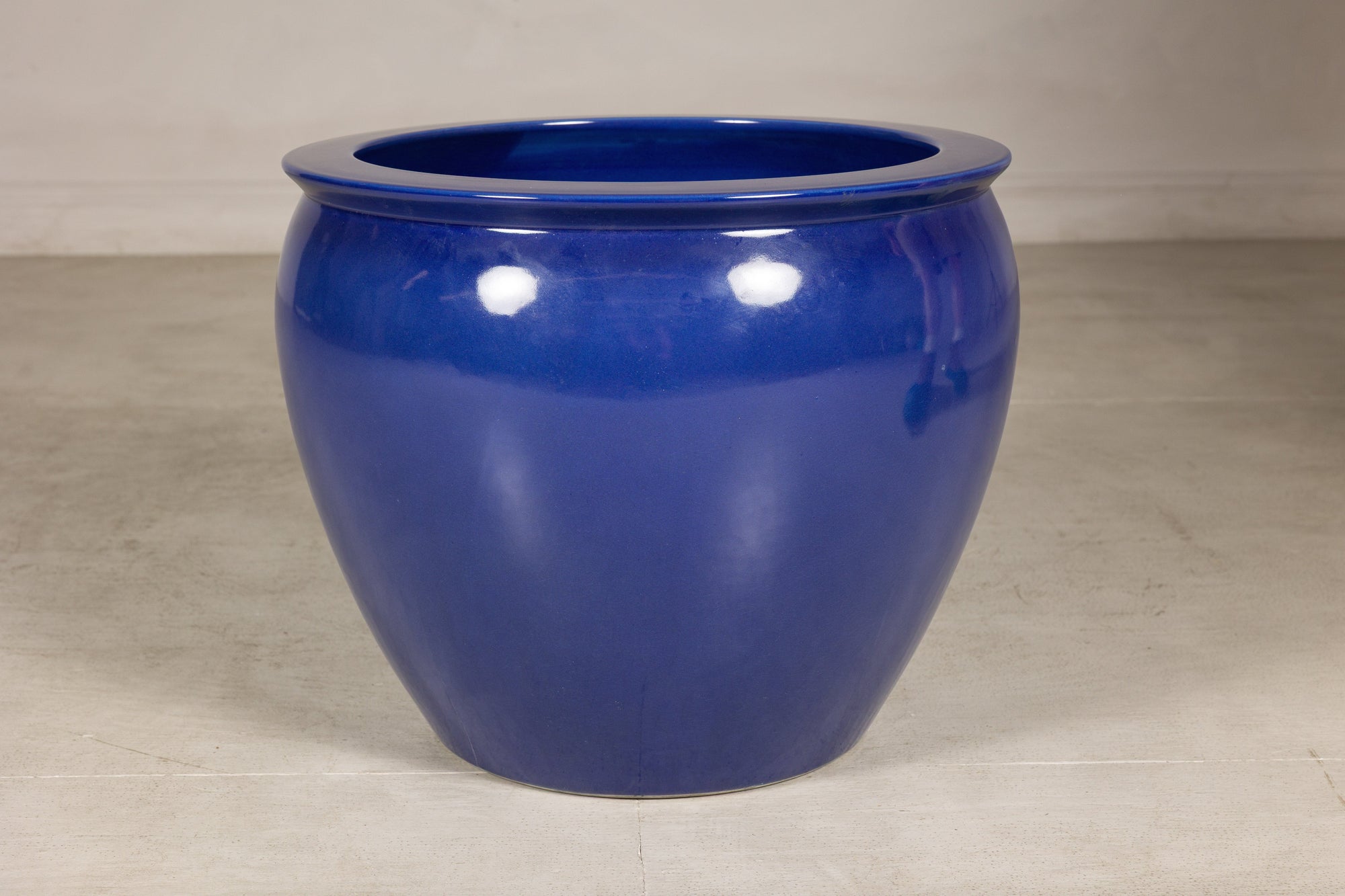 Right-side view of the cobalt blue planter with glossy glazed surface