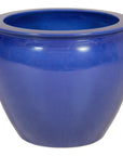 Cobalt blue glazed ceramic planter on a white background