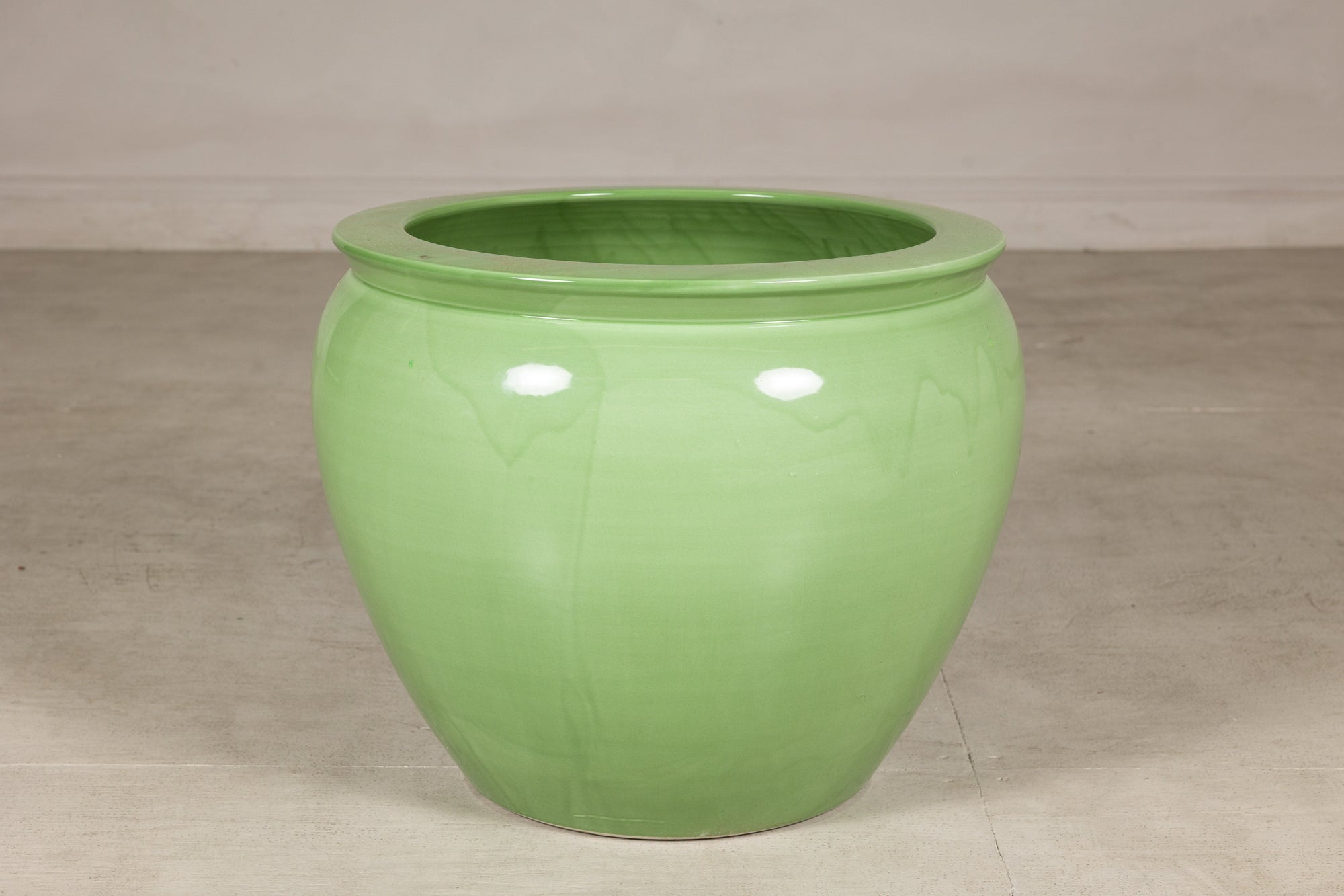 Apple green glazed ceramic planter front view