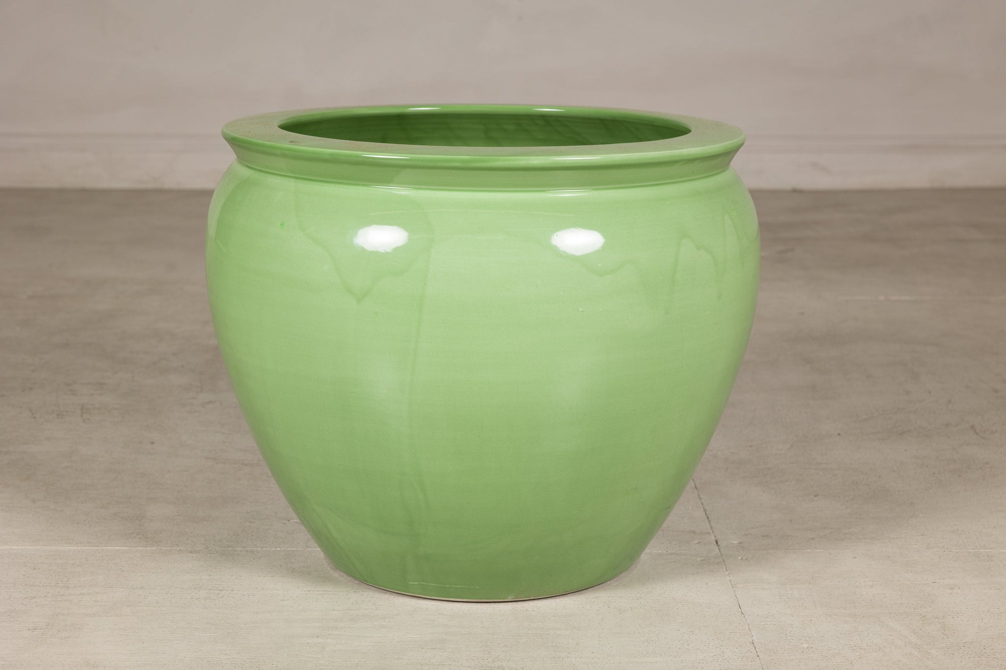 Apple green glazed ceramic planter angled view