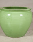 Apple green glazed ceramic planter angled view