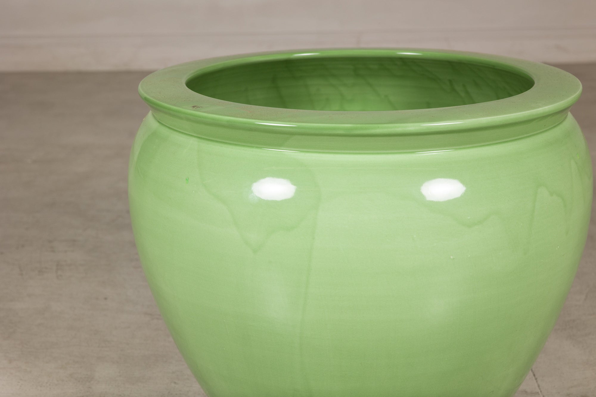 Apple green glazed ceramic planter side view