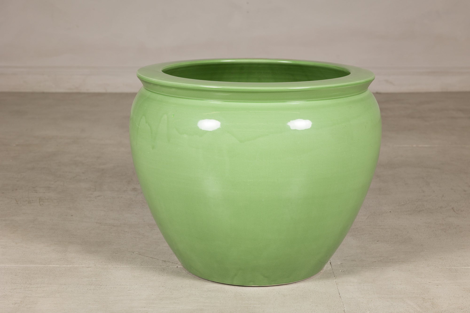 Apple green glazed ceramic planter back view