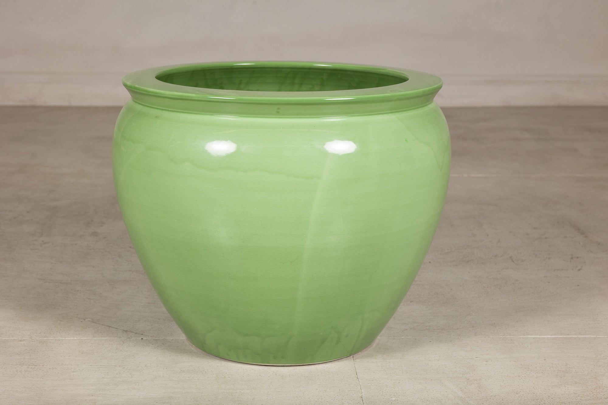 Apple green glazed ceramic planter base view