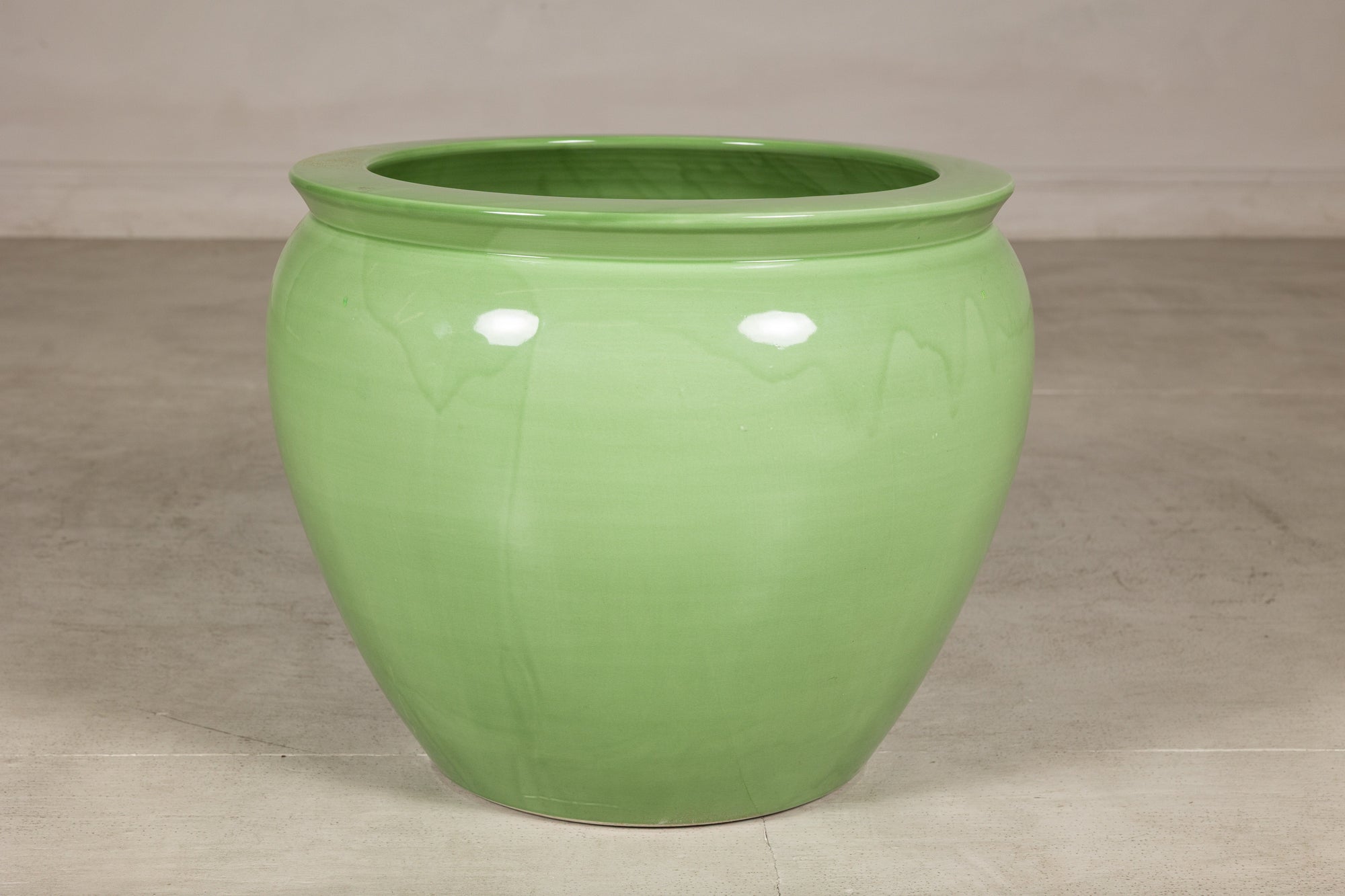 Apple green glazed ceramic planter surface detail