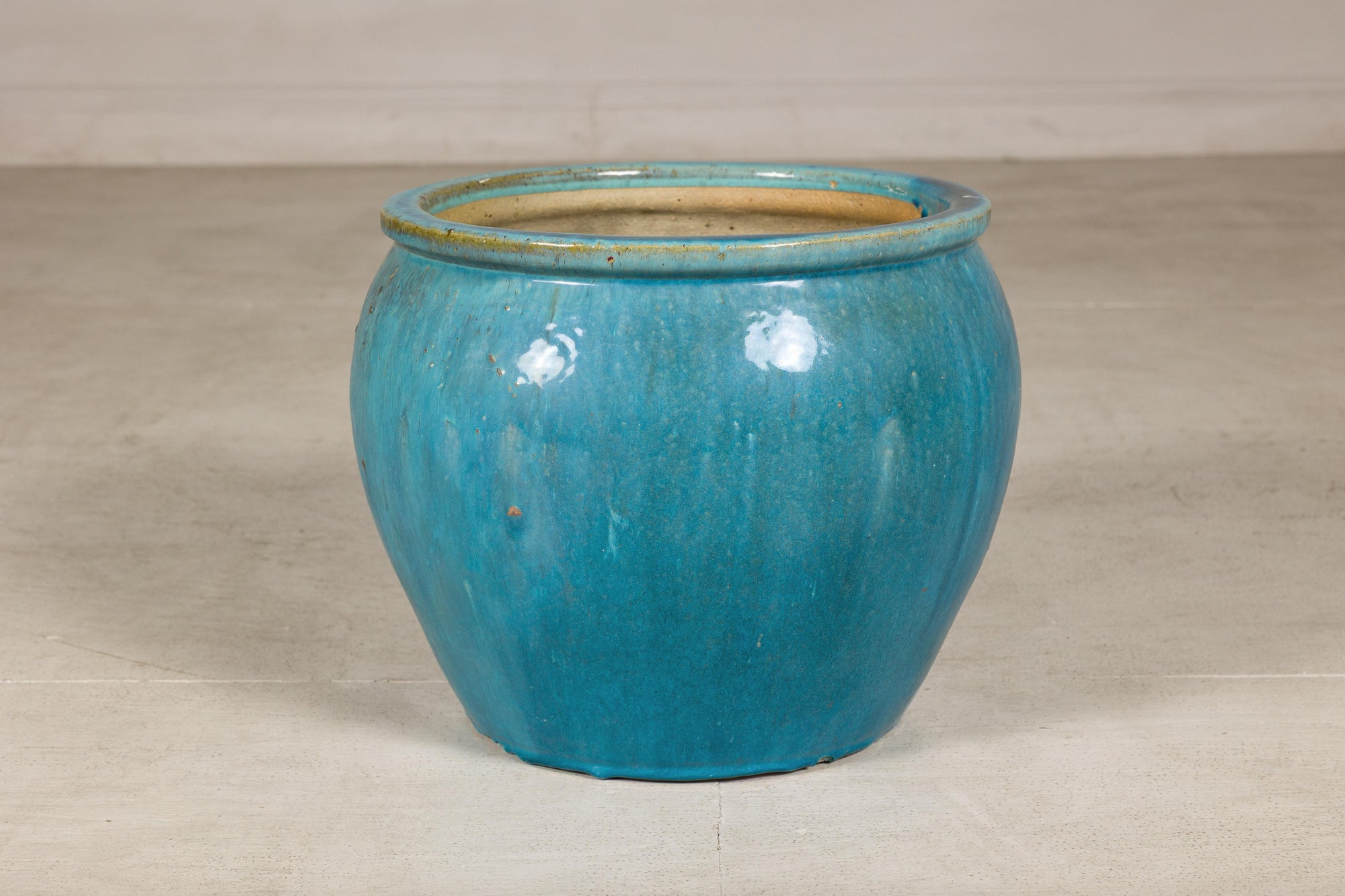 Turquoise glazed stoneware planter front view