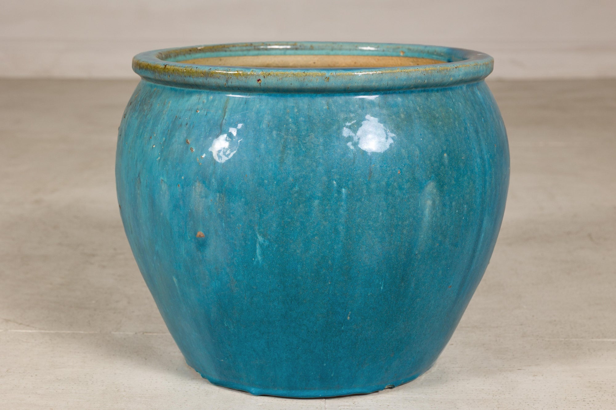 Turquoise glazed stoneware planter angled view