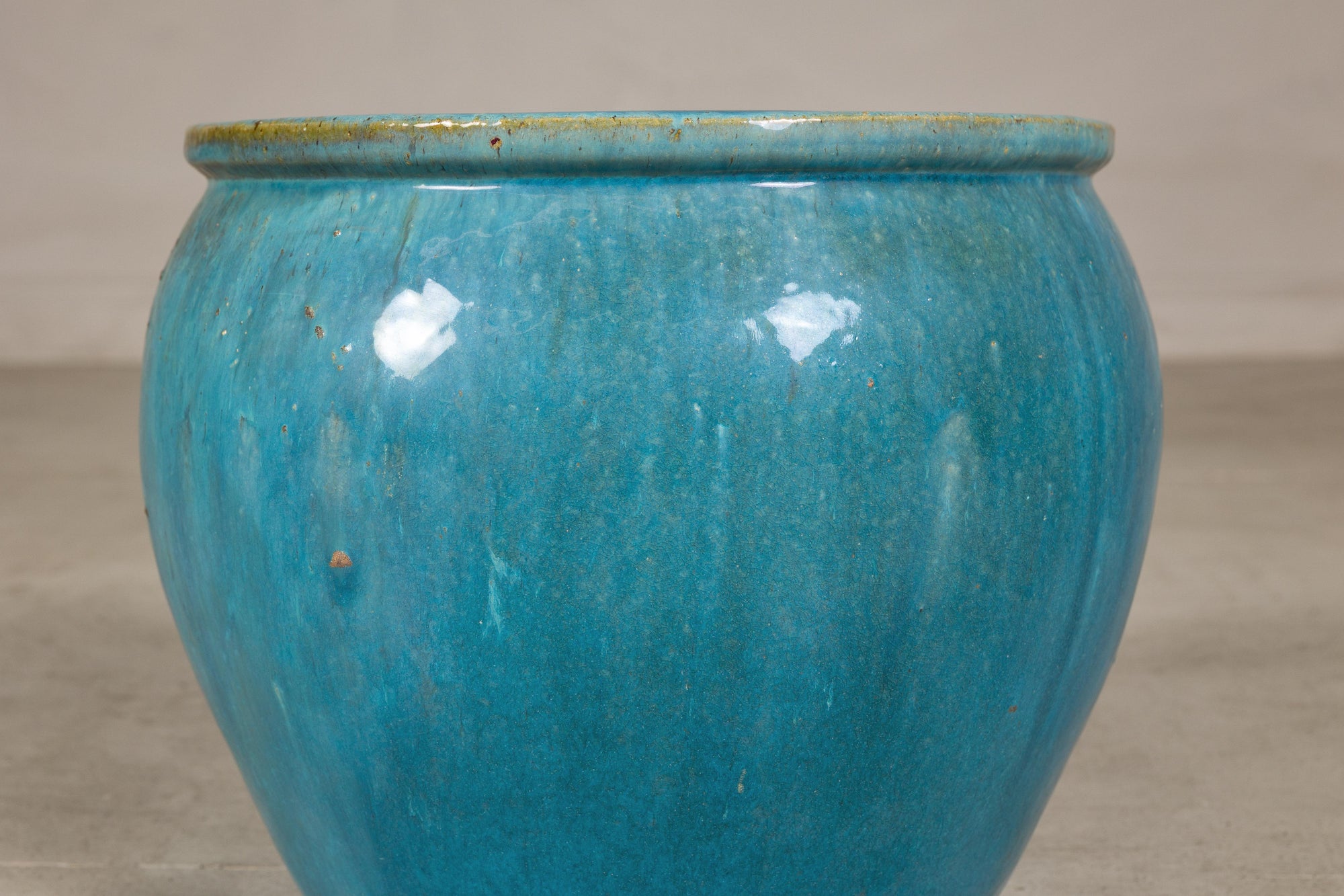 Turquoise glazed stoneware planter side view