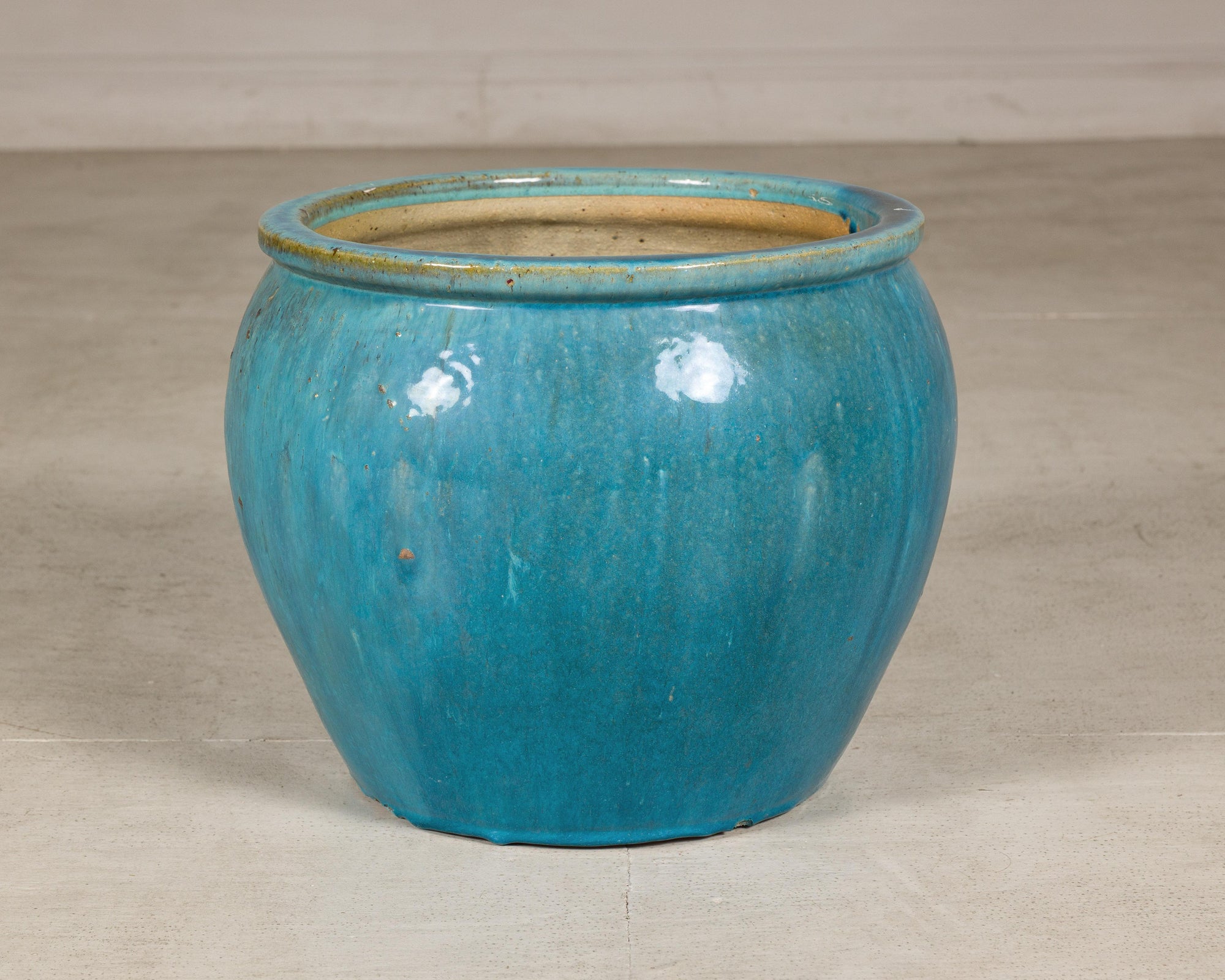 Turquoise glazed stoneware planter reverse angle