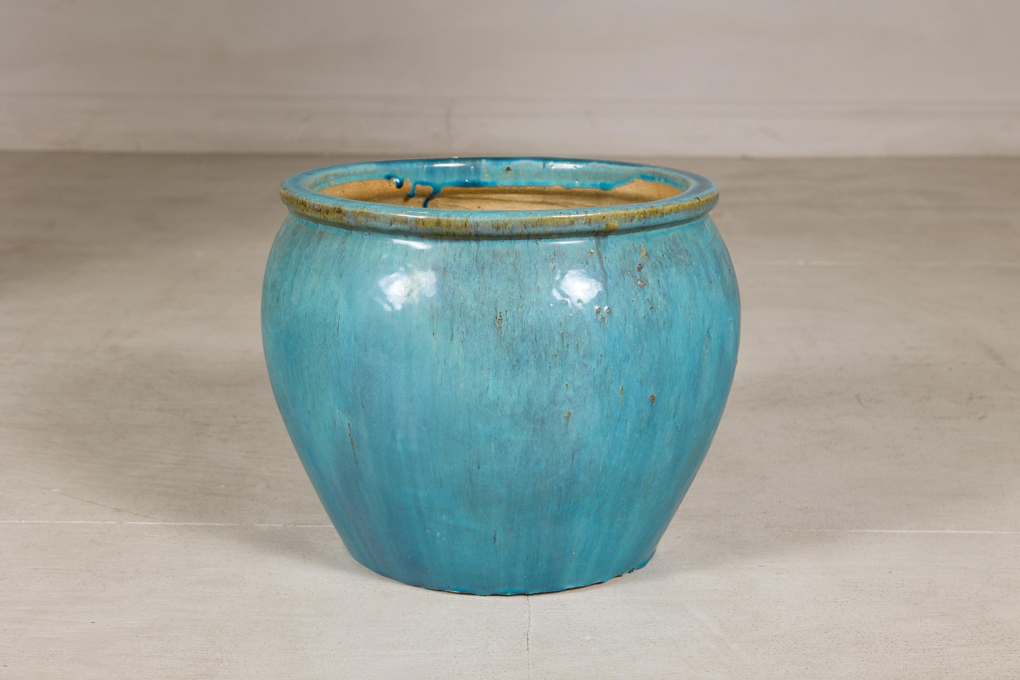 Turquoise glazed stoneware planter back view