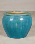 Turquoise glazed stoneware planter base view