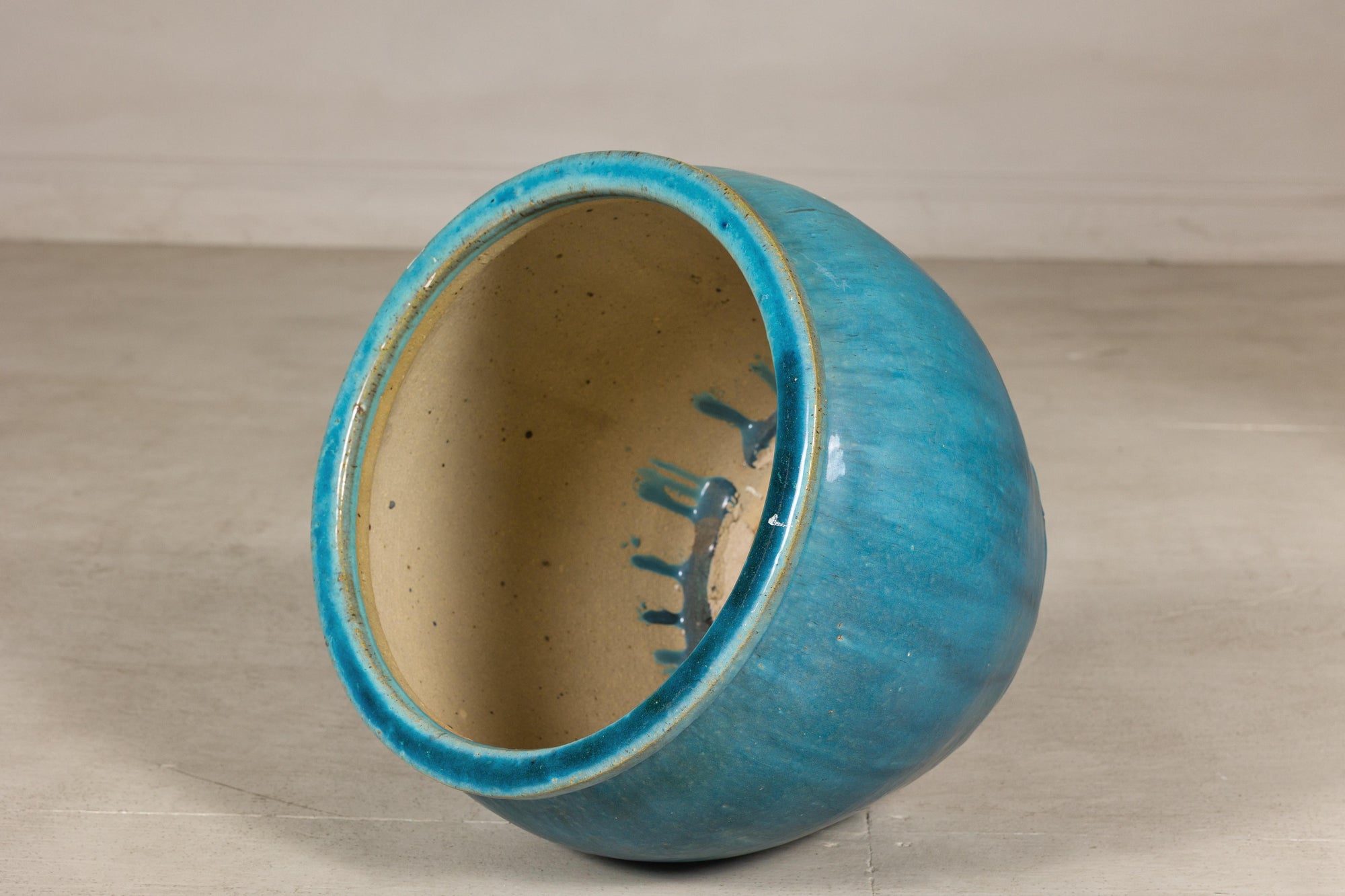 Turquoise glazed stoneware planter surface detail
