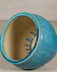Turquoise glazed stoneware planter surface detail