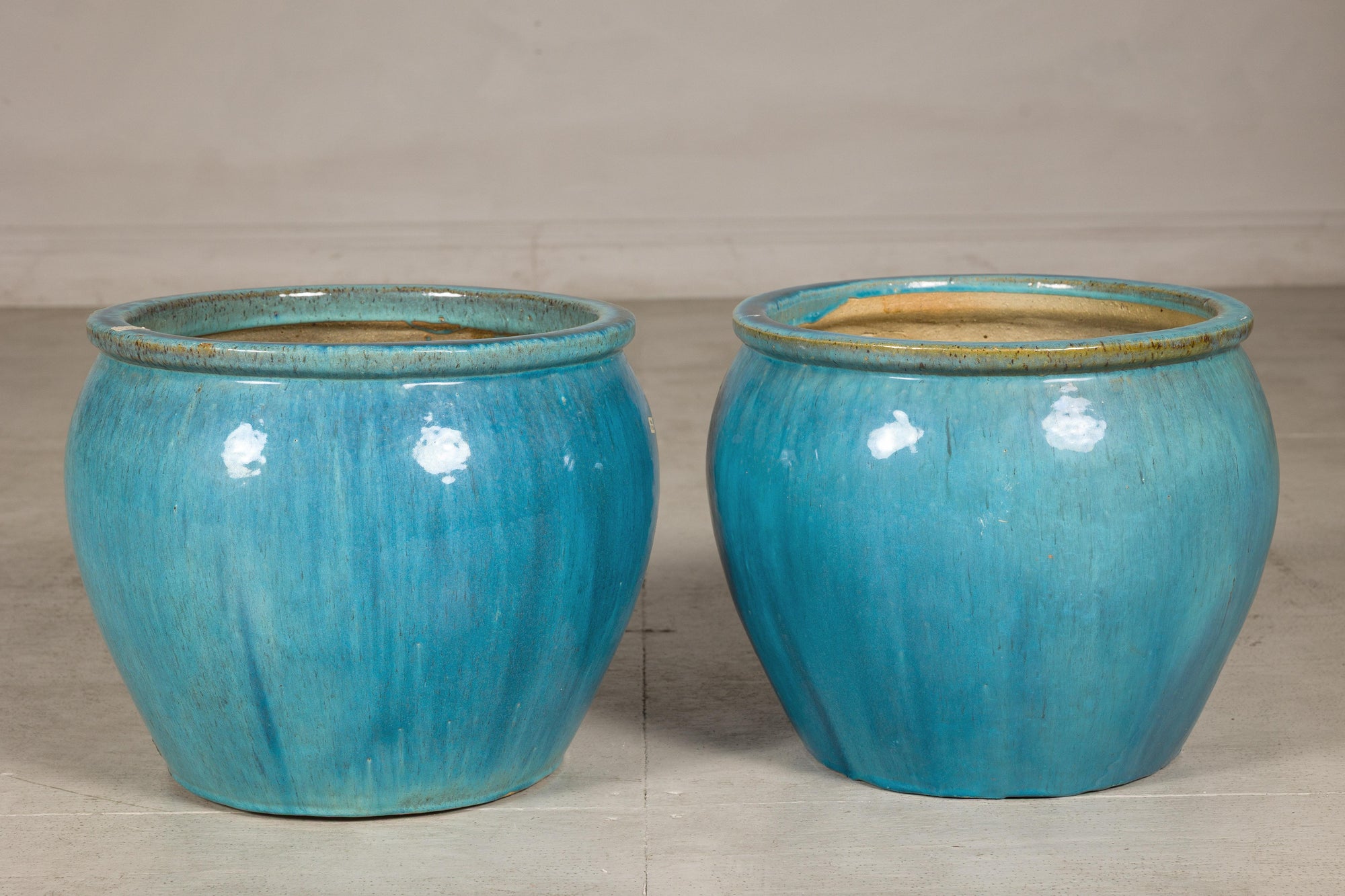 Turquoise glazed stoneware planter close-up detail