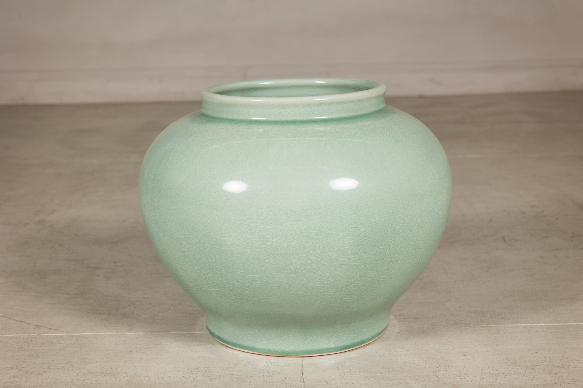Alternate front view of the pale celadon crackle glazed vase