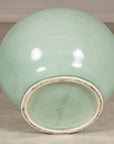 Bottom view showing the recessed foot of the celadon ceramic vase