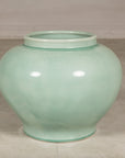 Front view of the rounded celadon ginger jar form vase