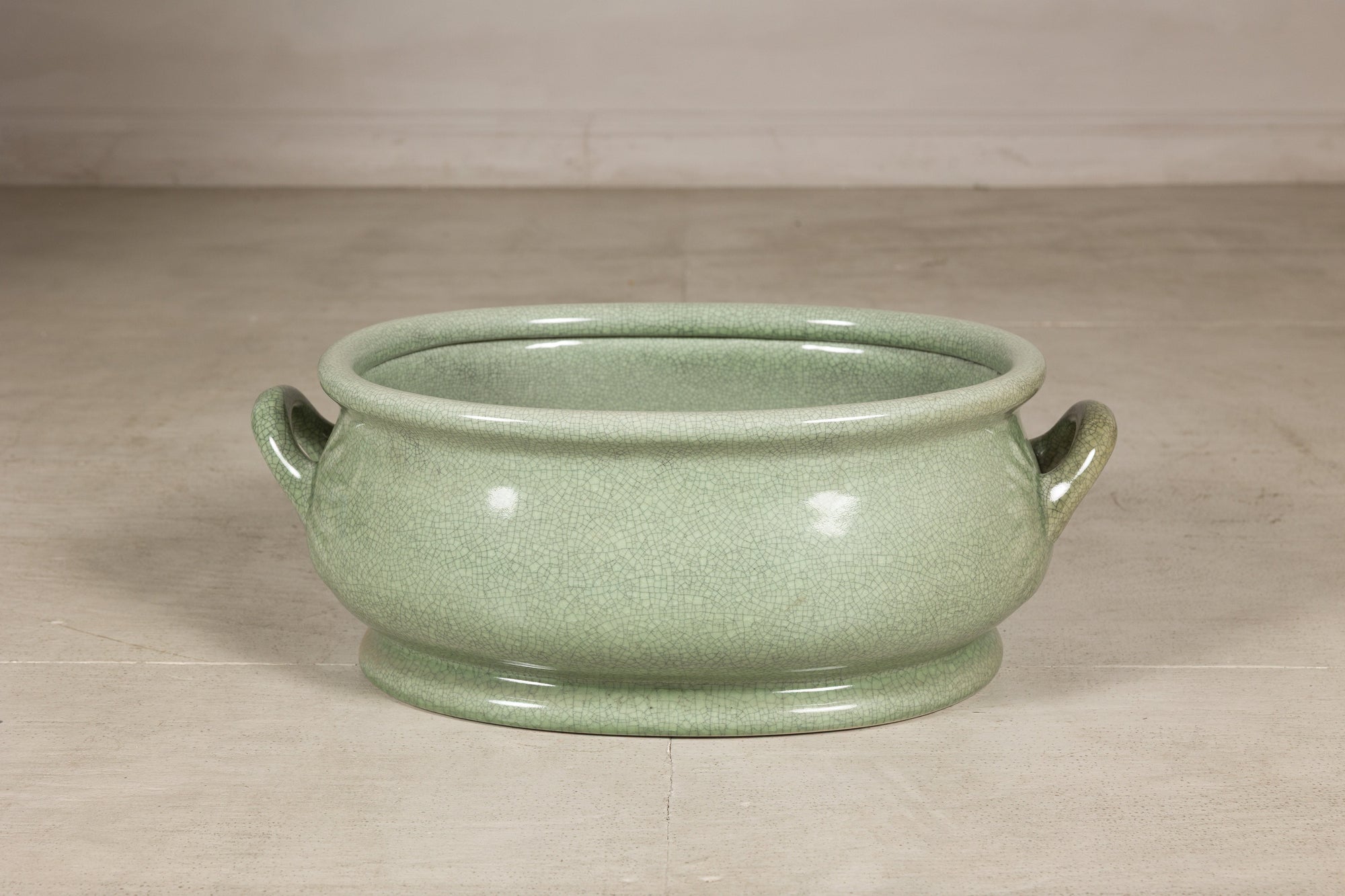 Alternate side view of the pale green crackle glaze footbath