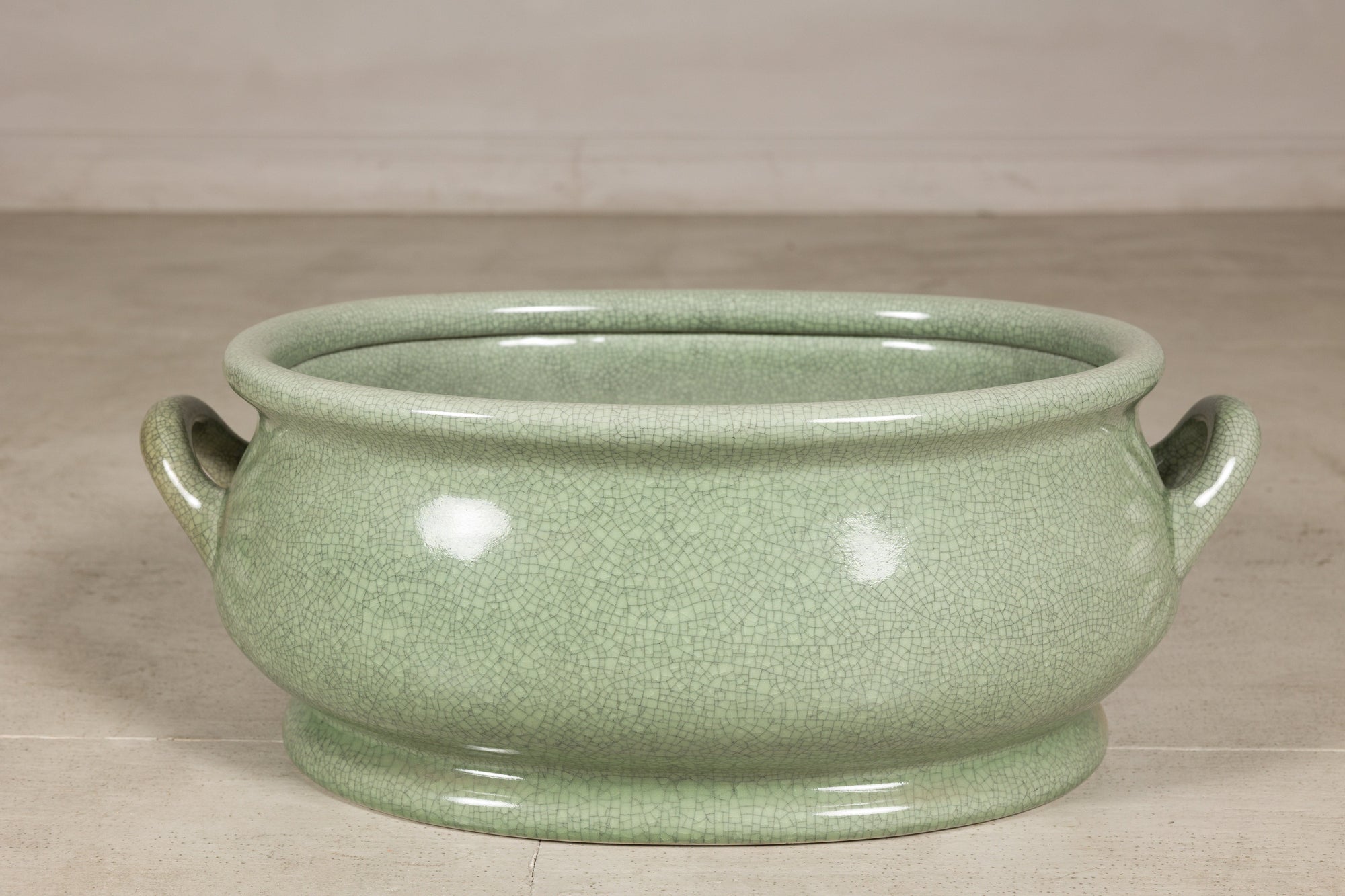 Close front view of the oval ceramic footbath and rolled rim