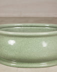 Close front view of the oval ceramic footbath and rolled rim