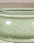 Close-up of the pale celadon crackle glaze and rounded body