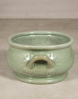 View centered on a loop handle and crackle glazed body