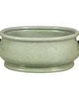 Celadon crackle glaze ceramic footbath with loop handles on a white background