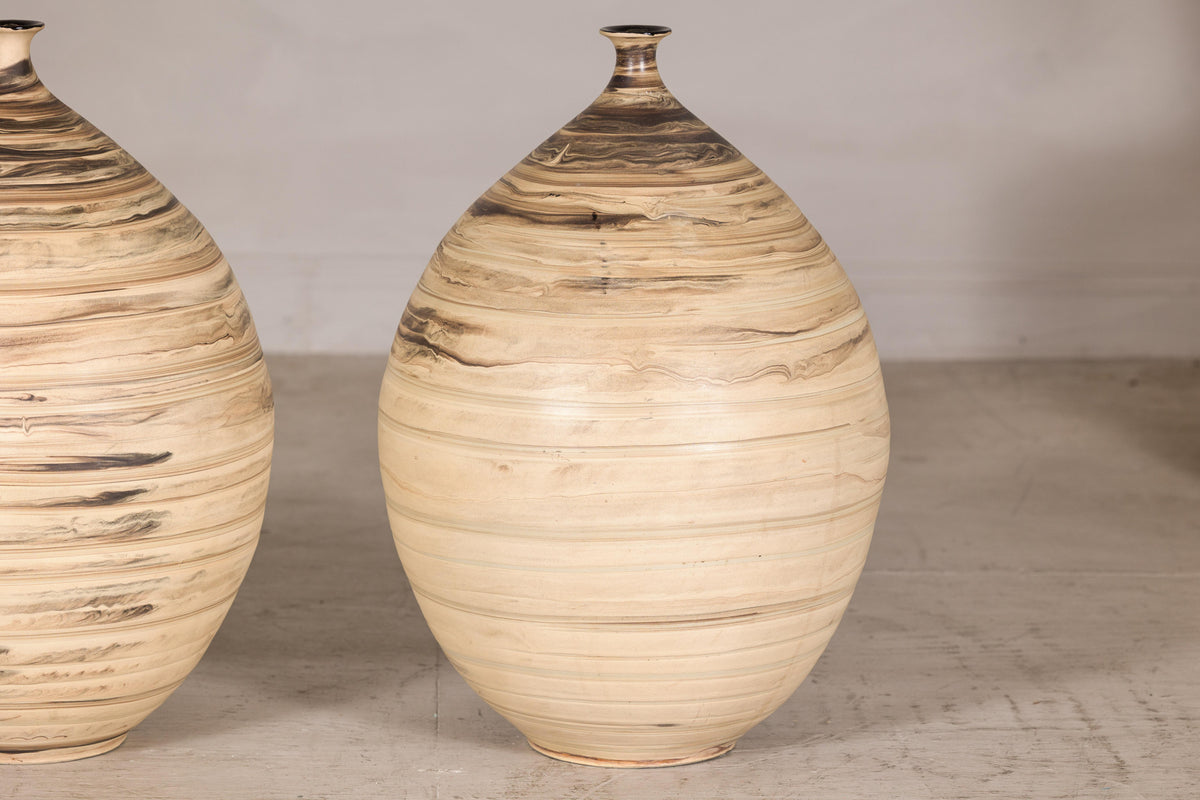 Large cream and brown glazed artisan ceramic floor vase, profile view