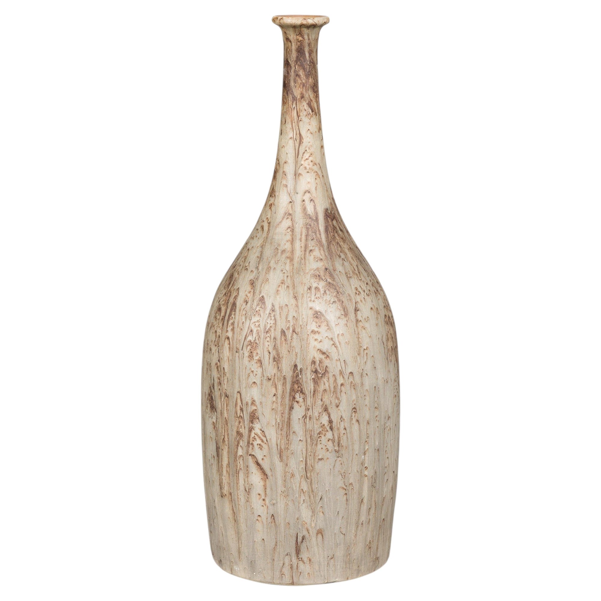 Cream and brown drip-glazed ceramic vase with narrow neck, textured surface, close-up.