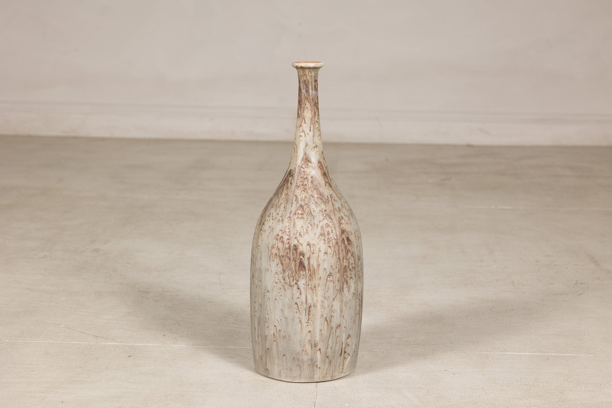 Cream and brown glazed ceramic bottle vase back view