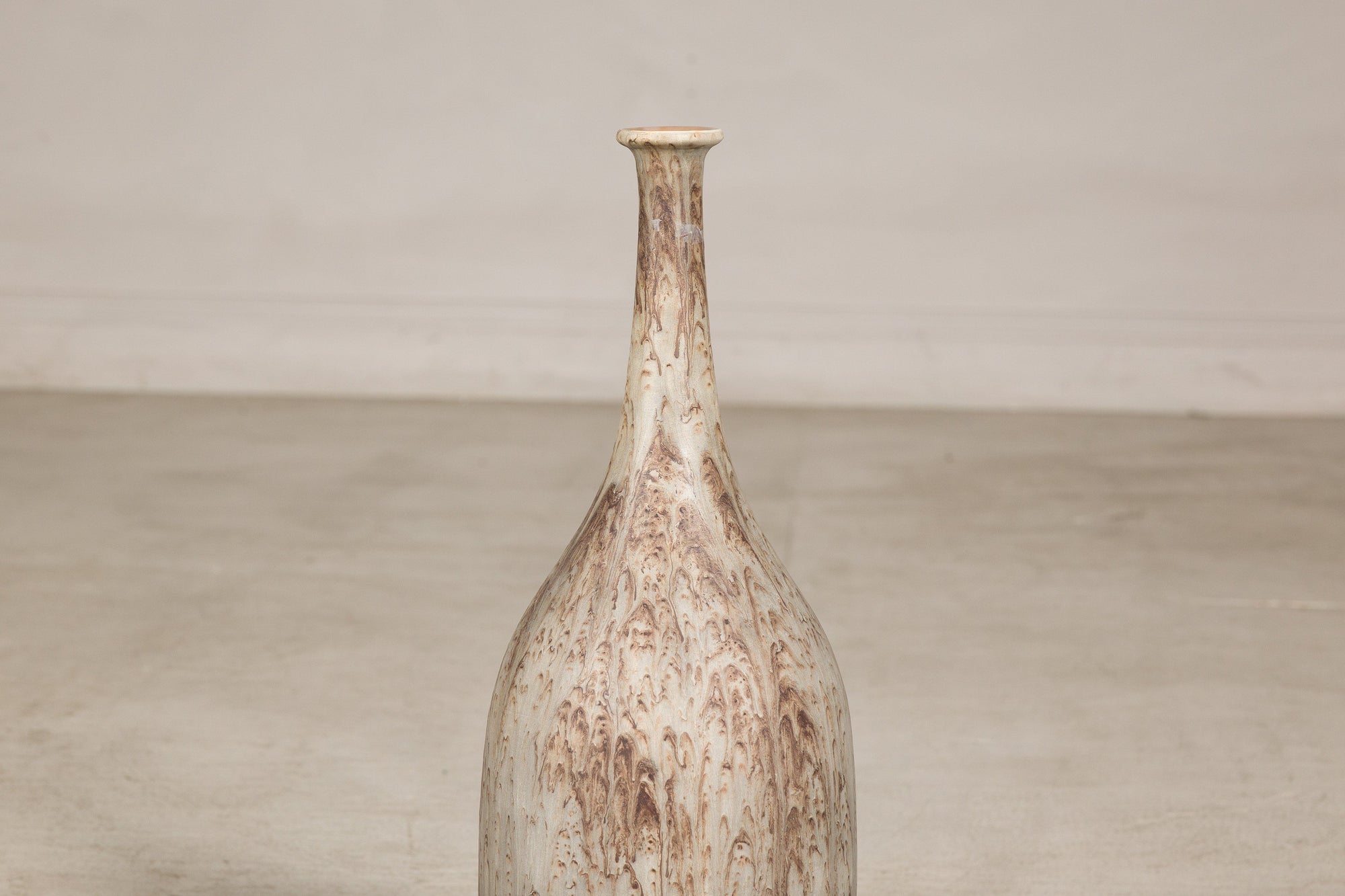 Cream and brown glazed ceramic bottle vase top view