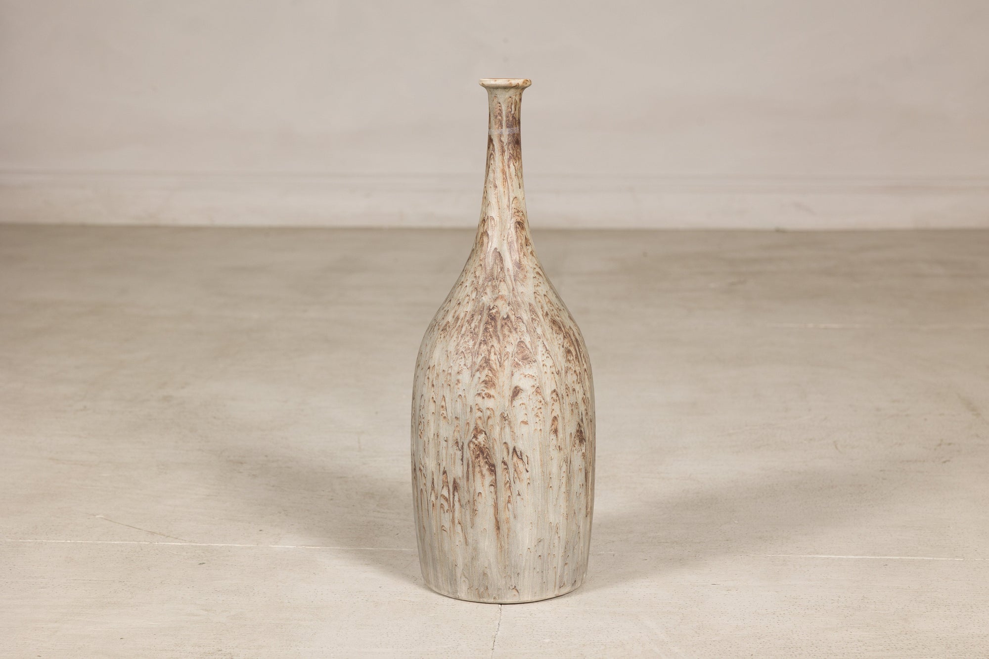 Cream and brown glazed ceramic bottle vase surface detail