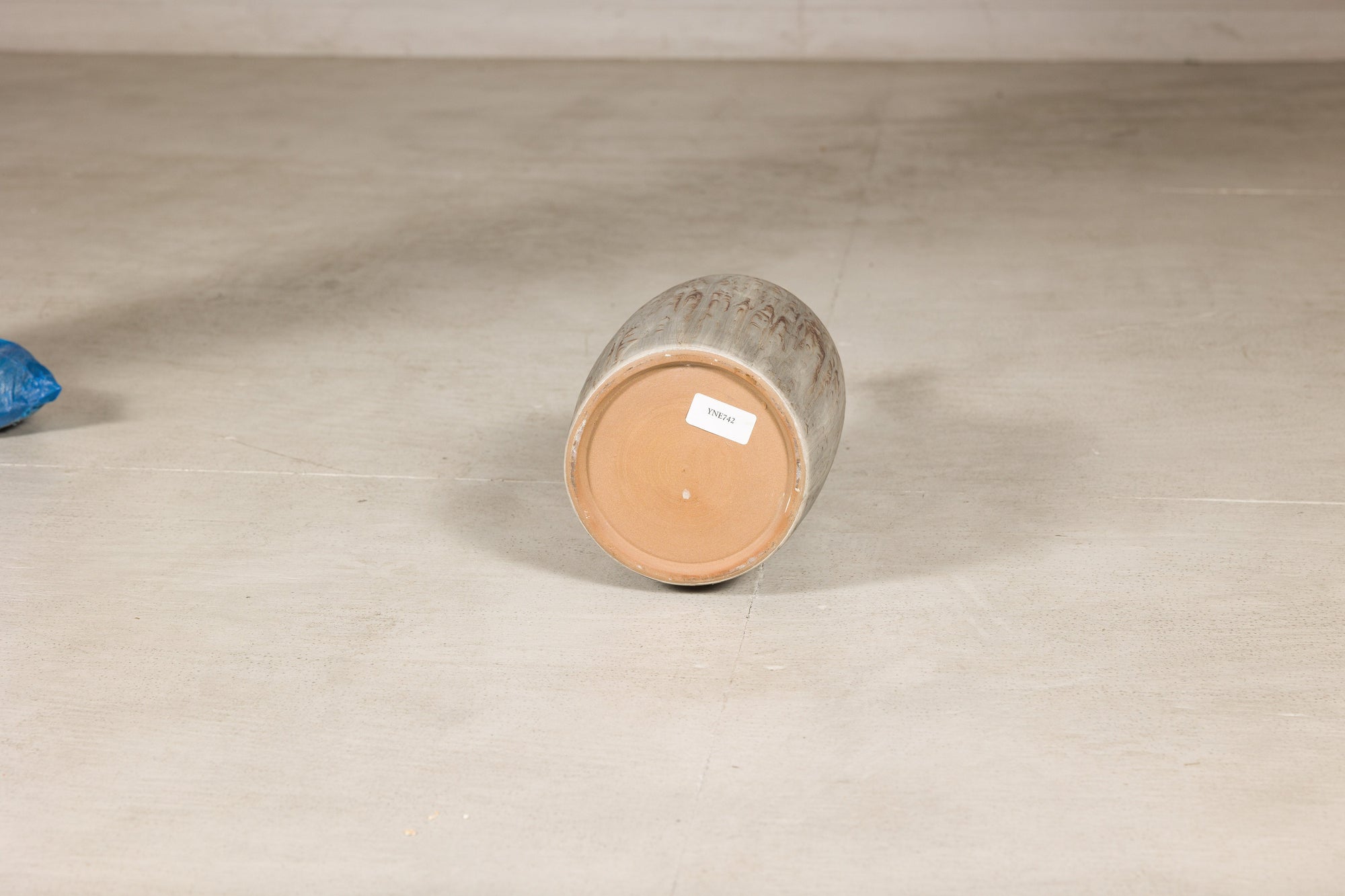 Cream and brown glazed ceramic bottle vase construction detail