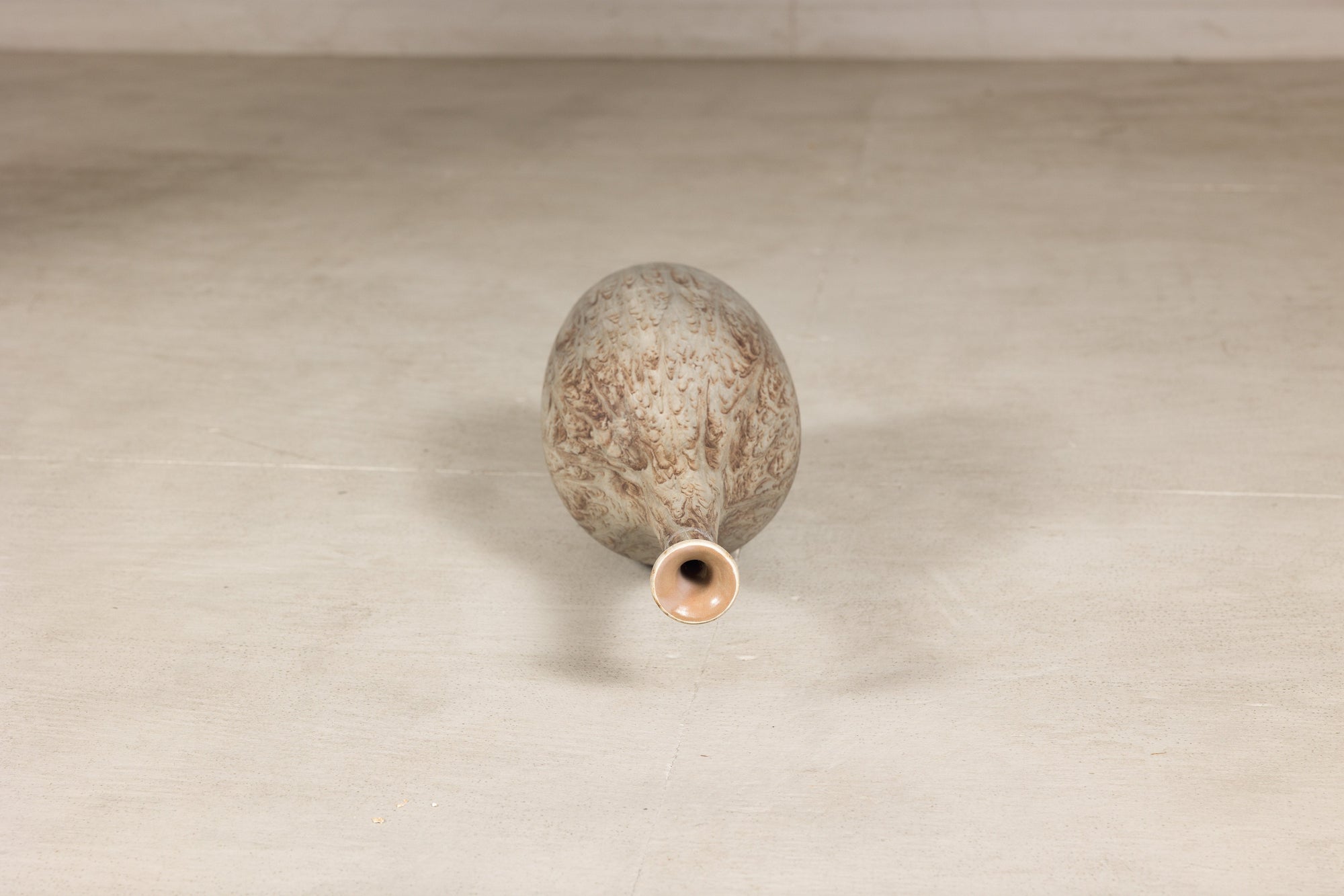 Cream and brown glazed ceramic bottle vase close-up detail