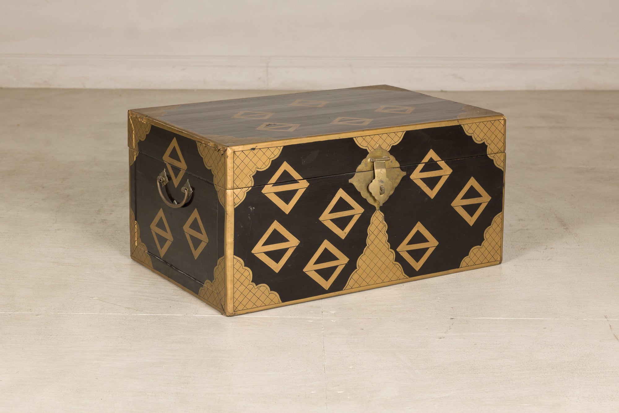 Black lacquered Chinese chest, three-quarter left view