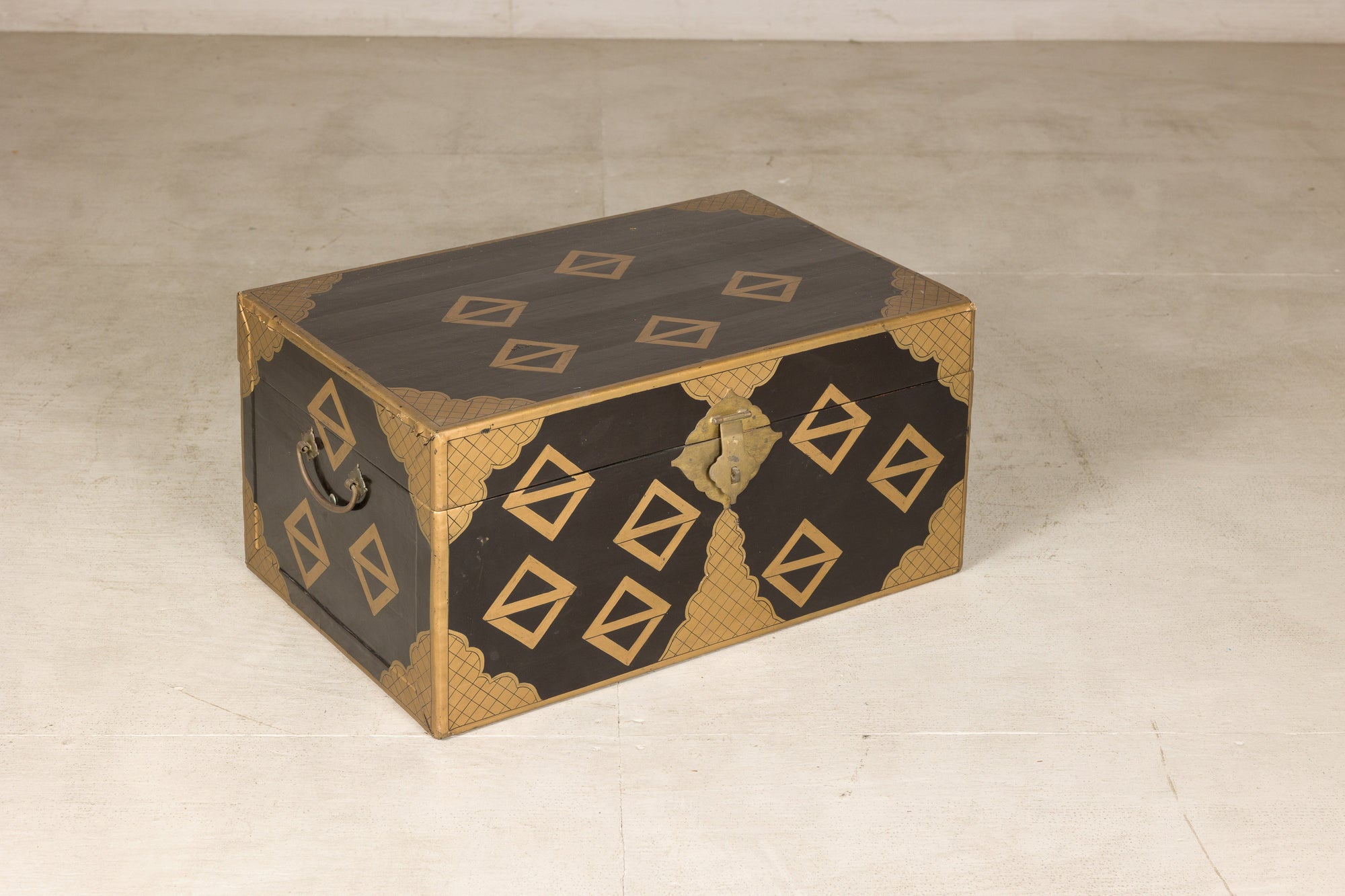 Black lacquered storage chest, three-quarter right view