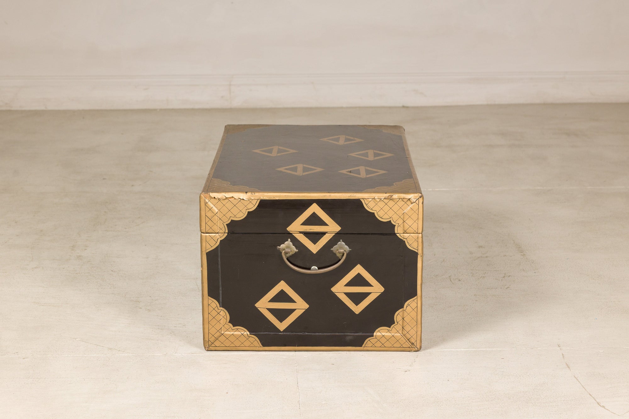 Black lacquered Chinese chest, end view